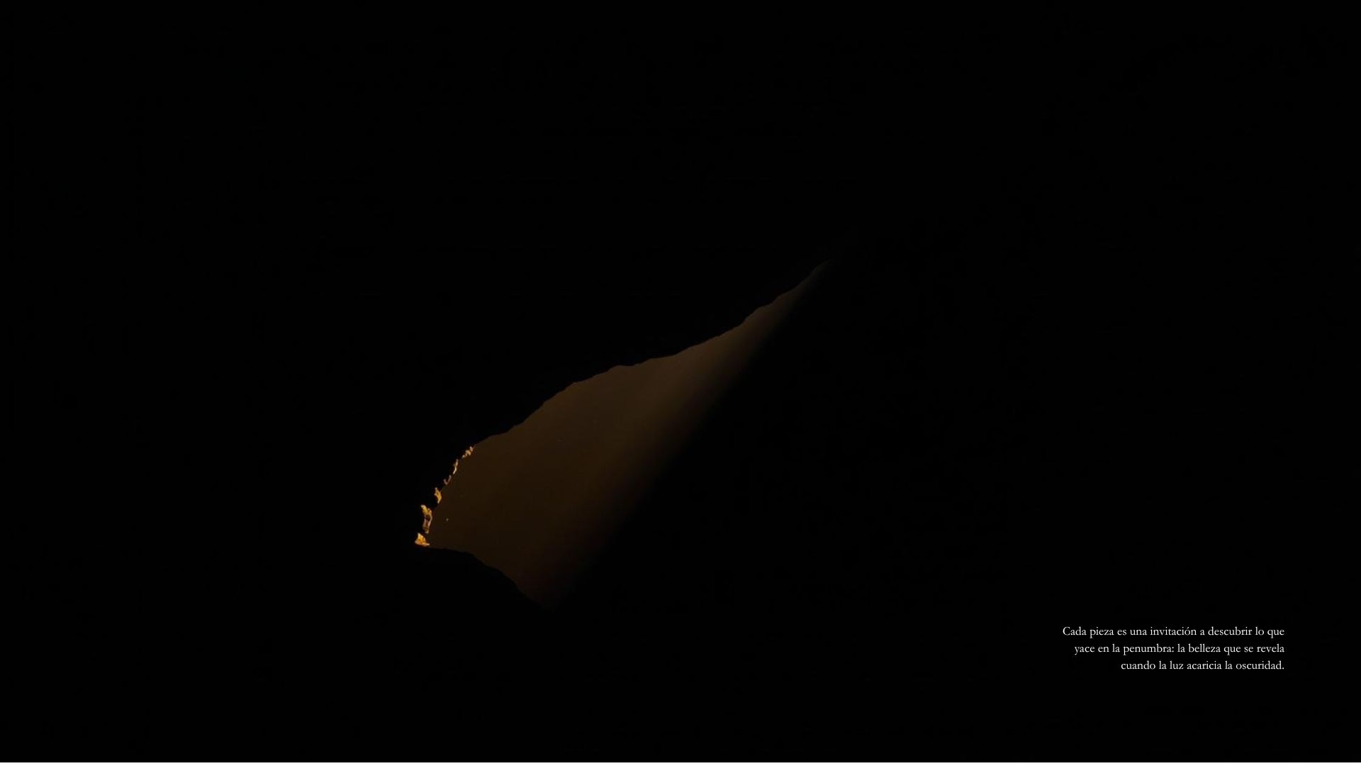 A golden edge surfacing from total darkness.